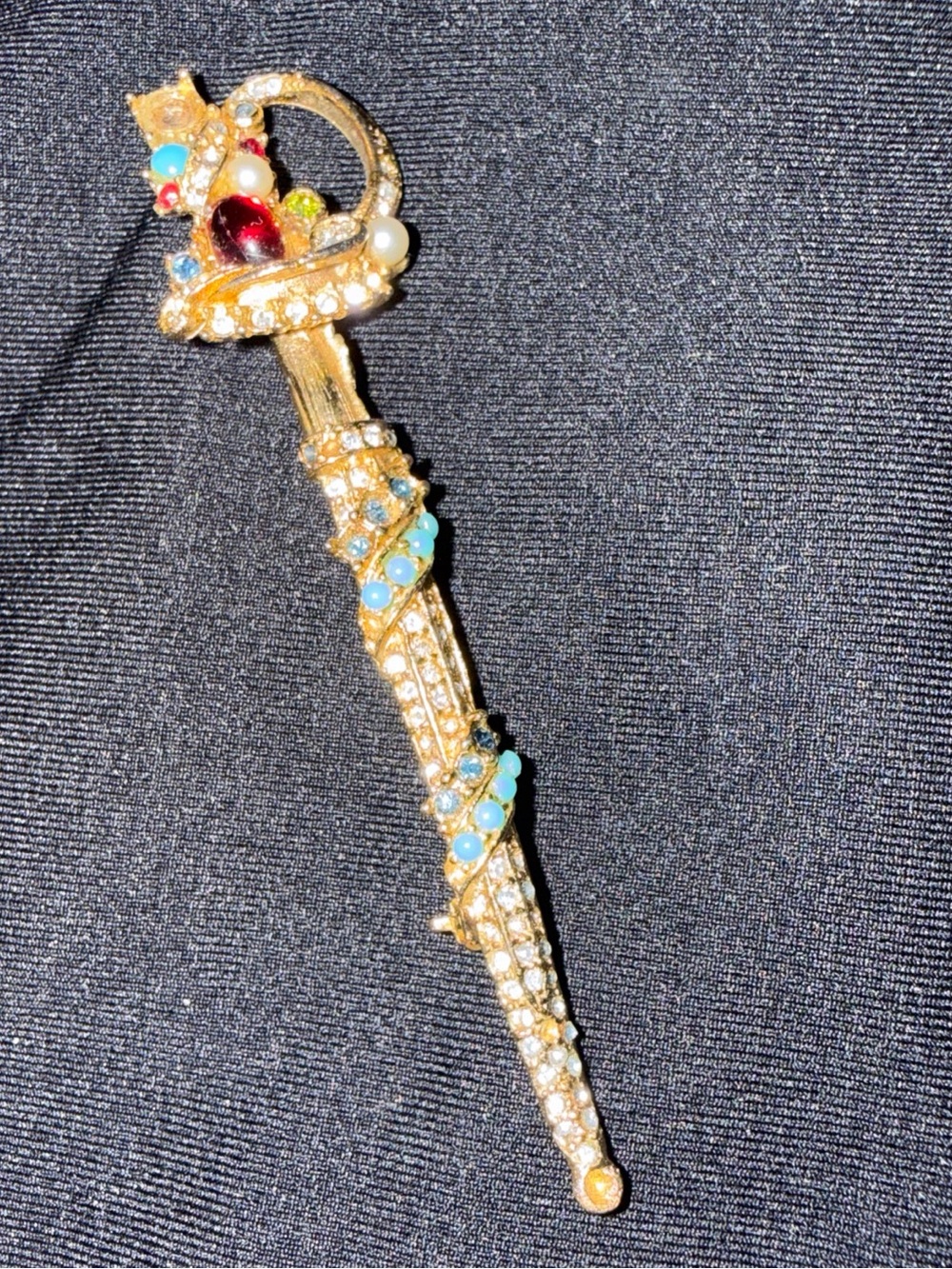 Gold-Tone Jeweled Dagger Brooch with Turquoise and Red Accents
